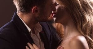 A couple having an affair kissing