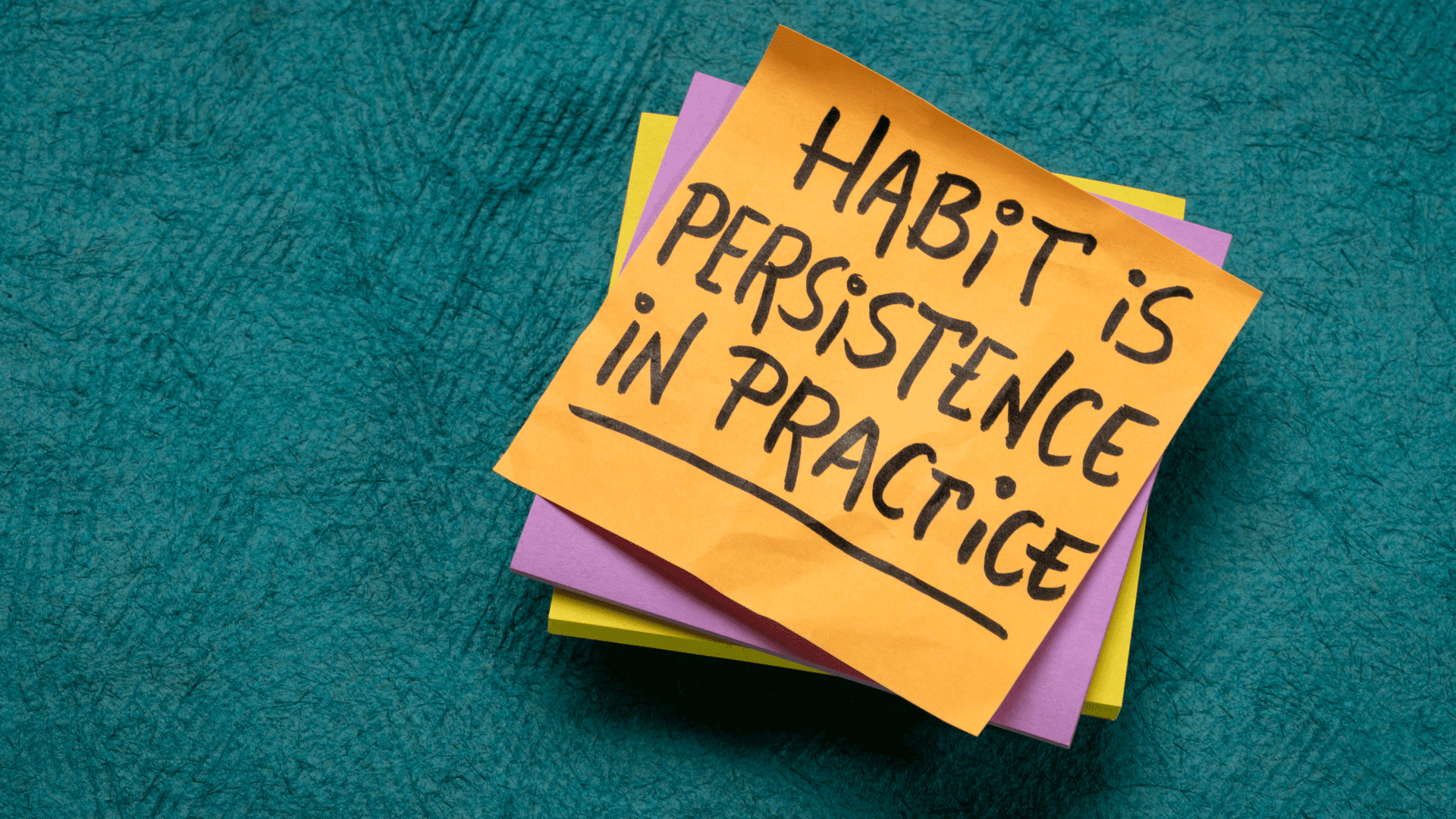 a stack of post-it notes with black text on it saying habit is persistence in practice referencing cracking the habit code through neuroscience