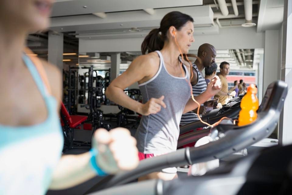 Image of a woman on a treadmill trying to "keep it together" by separating personal struggles from affecting her professional life, Managing Personal Struggles in Professional Life