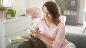 In The Press Woman sitting on couch