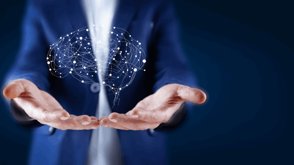 Transform Your Reality: Unleashing the Power of Neuroscience and Neuroplasticity for Personal Growth 9 Polygonal brain floating above hands, representing the power of brain-based coaching and understanding neuroplasticity for personal growth.