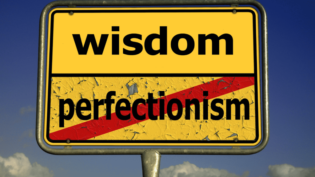Picture of a yellow sign that is describing the difference between having wisdom which is better than perfectionism.