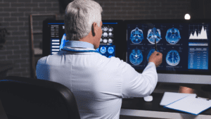 Doctor analyzing brain scan focused on prefrontal cortex for executive functions and neuroplasticity