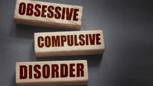 Blocks spelling out Obsessive Compulsive Disorder, illustrating the importance of Neuroscientific Life Coaching as an effective treatment for OCD symptoms.