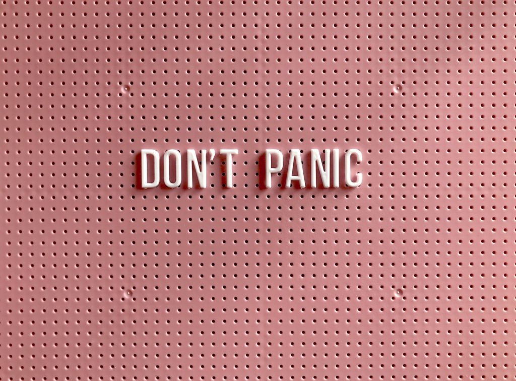 Don't panic sign indicating psychology first aid.