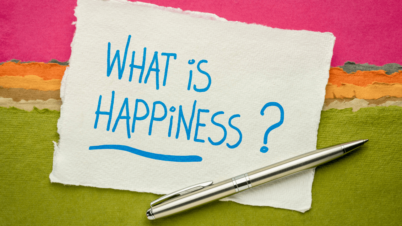 Colorful sign posing the thought-provoking question what is happiness