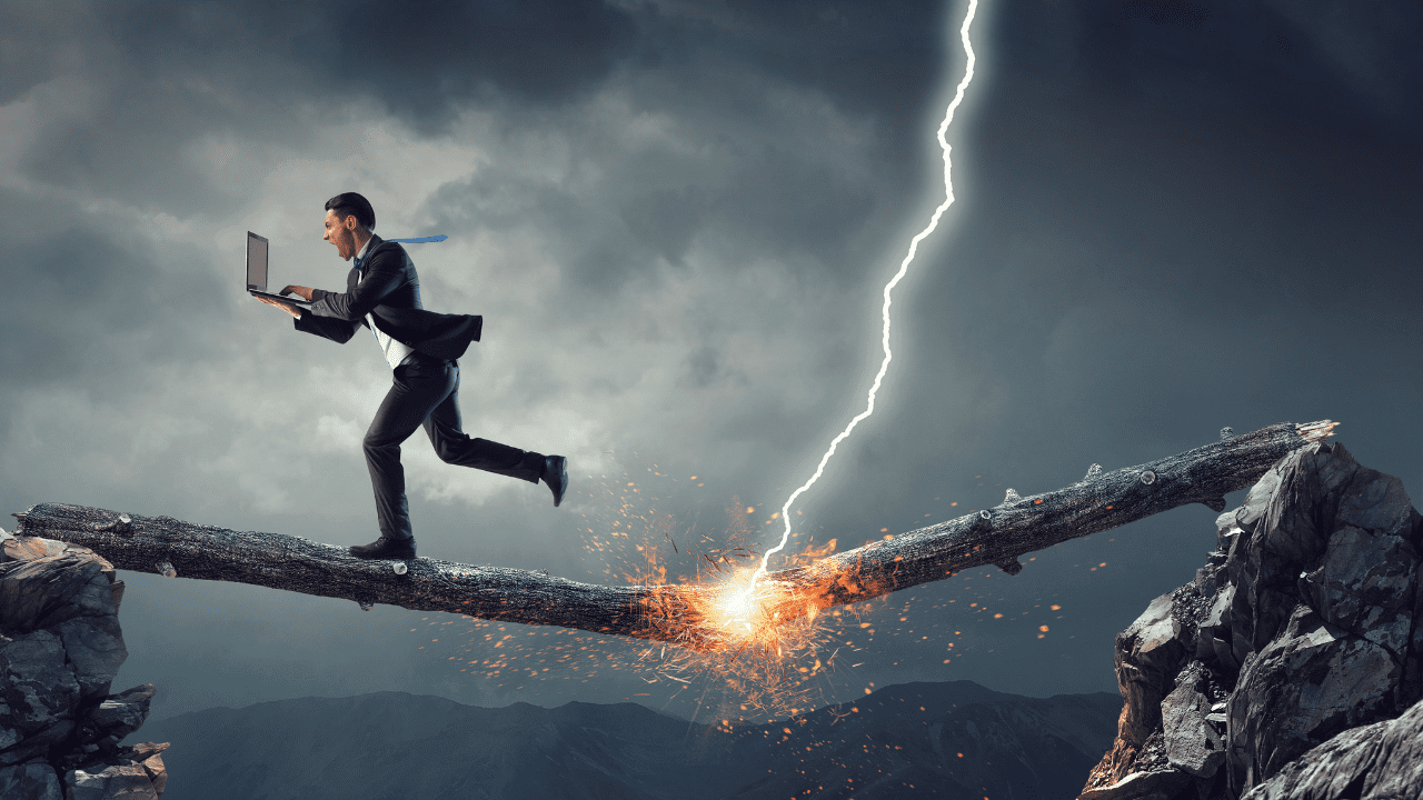 Businessman holding laptop running across a lightning-struck branch, symbolizing overcoming fears and excuses through cognitive restructuring," Cognitive Reframing