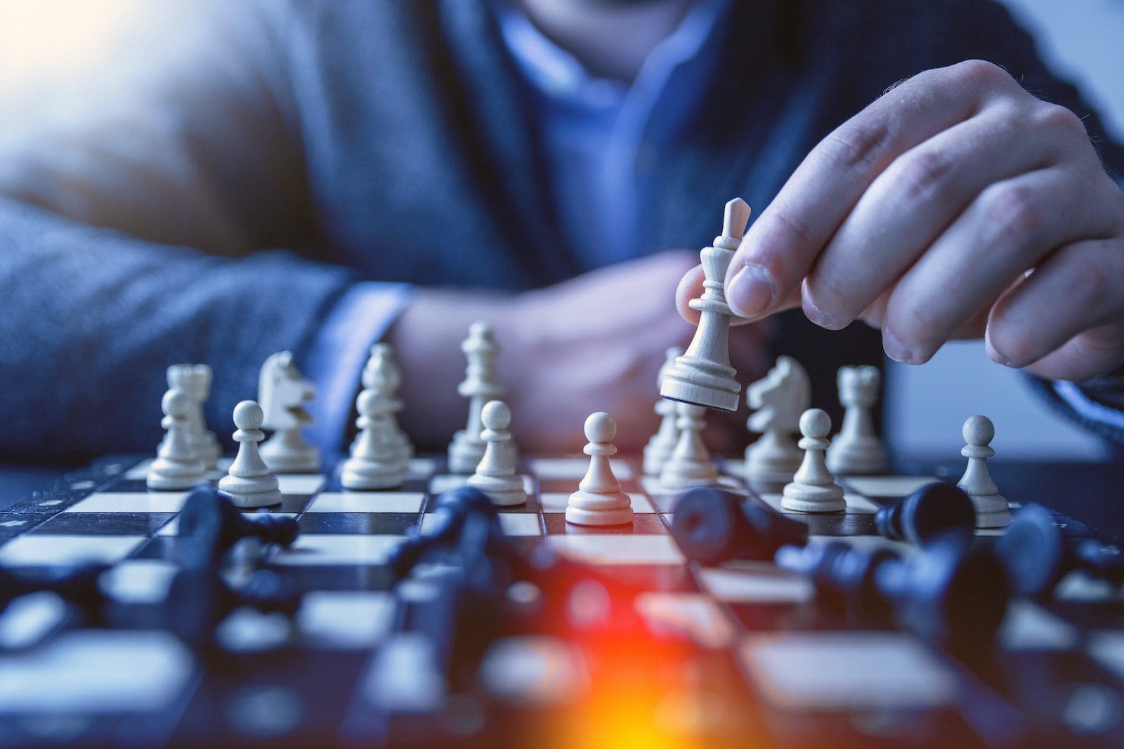 depth of field photography of man playing chess, How a Life Coach Can Guide Professionals