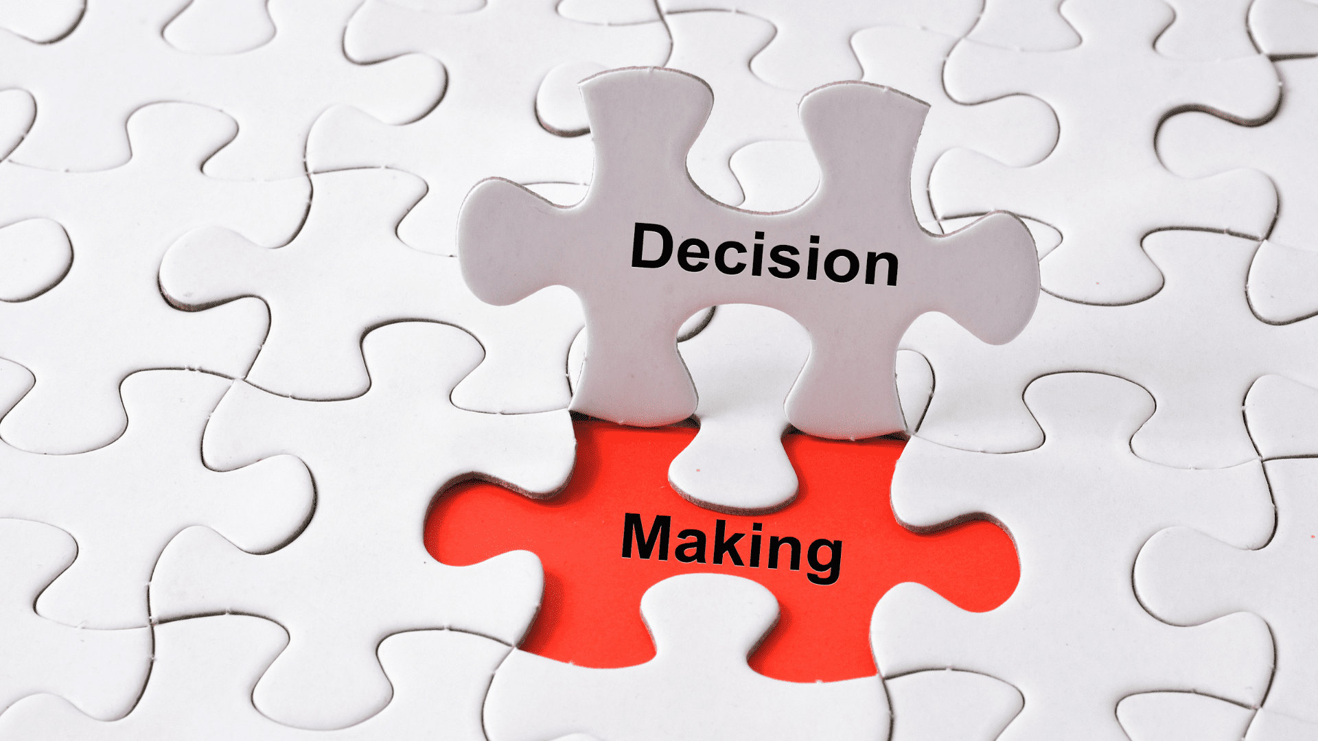 Puzzle pieces labeled "Decision Making" fitting together.