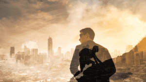 Neuroscience Updates 42 A man's silhouette overlooking a cityscape merges with him climbing a mountain, symbolizing the heights of goal-setting.