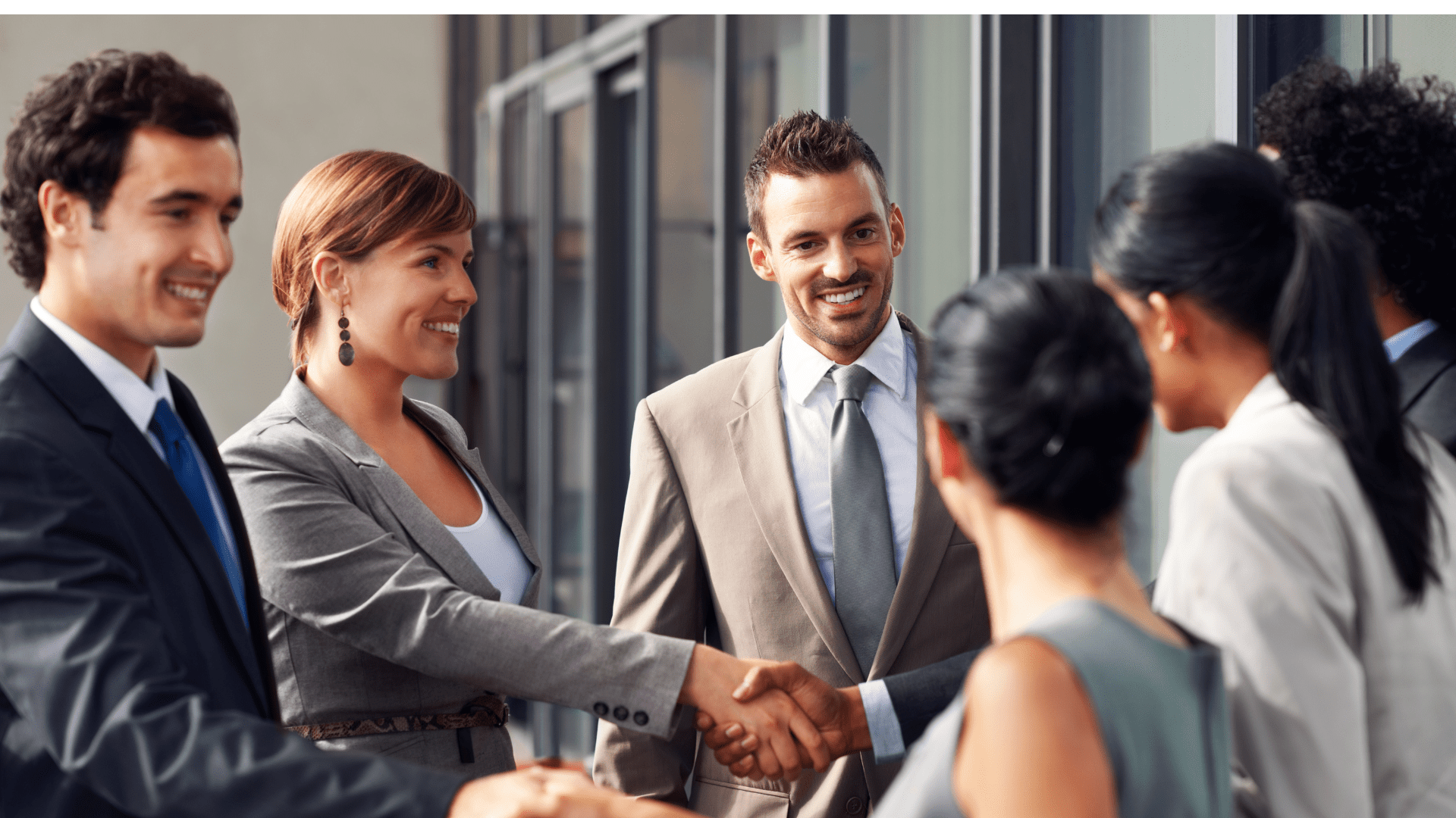 a group of professional men and women shaking hands The neuroscience of relationships: Exploring how our brains shape and are shaped by our social connections. #NeuroscienceOf Relationships