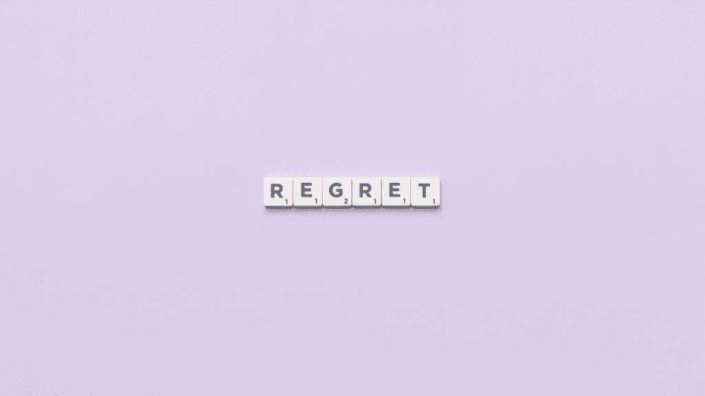 A purple background with tiles spelling out regret for the hurtful things we say