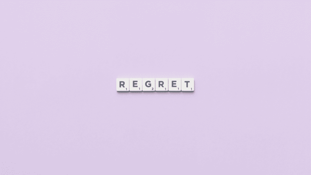 a purple background with tiles spelling out regret for the hurtful things we say