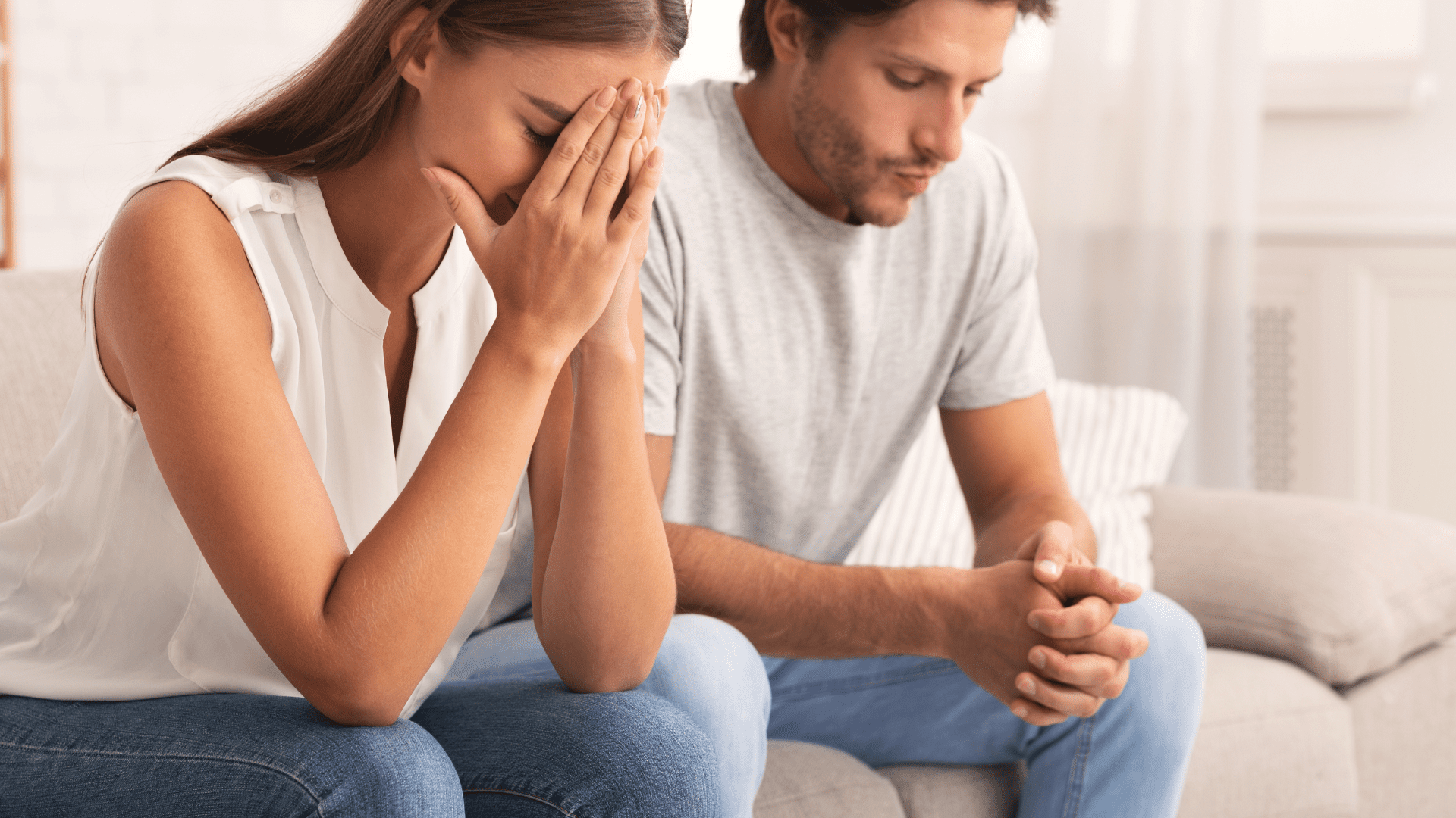 a man and woman sitting on a couch