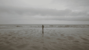 a person walking on a beach