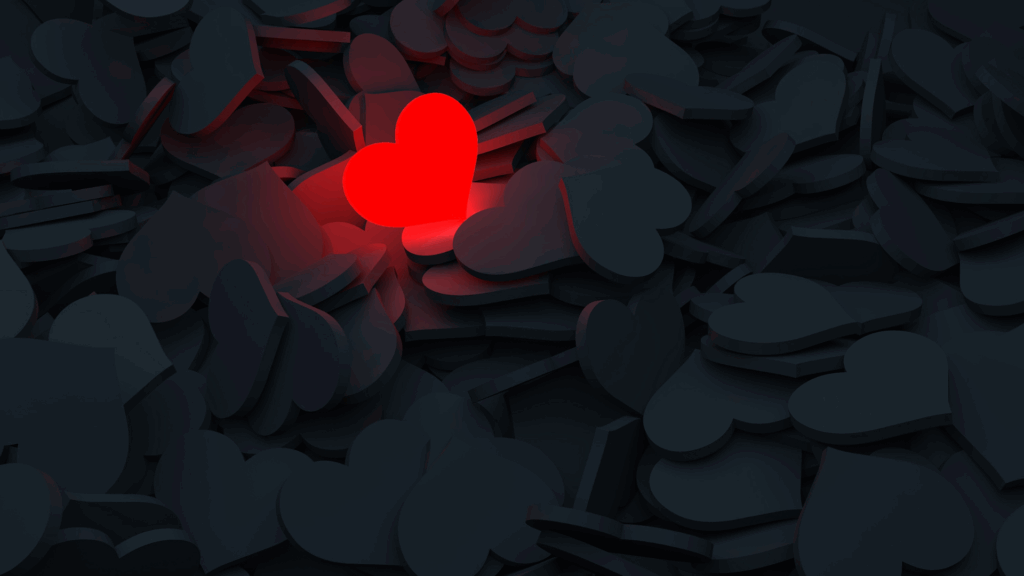 a lonely red heart surrounded by black hearts