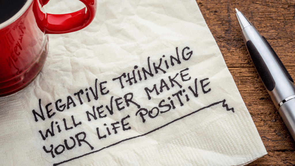 a napkin with black text on it saying negative thinking will never make your life positive