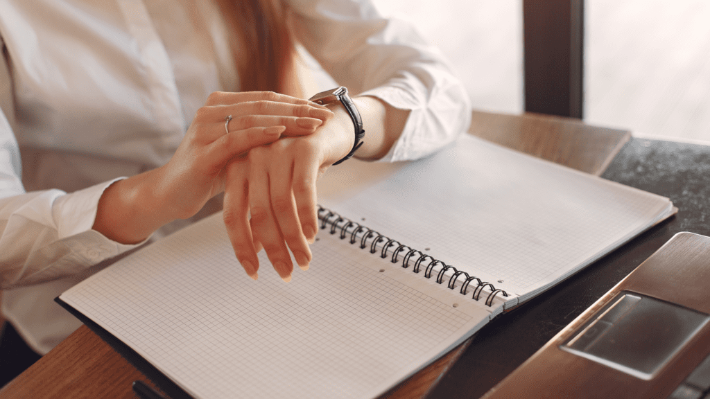 A woman's hands on a notebook