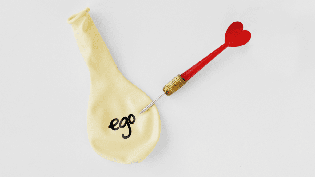 A deflated balloon labeled "ego" pierced by a dart.
