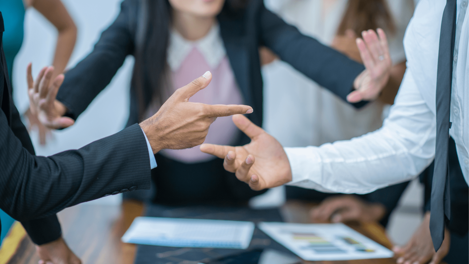 Master confrontation during a meeting, showcasing various styles of conflict resolution.