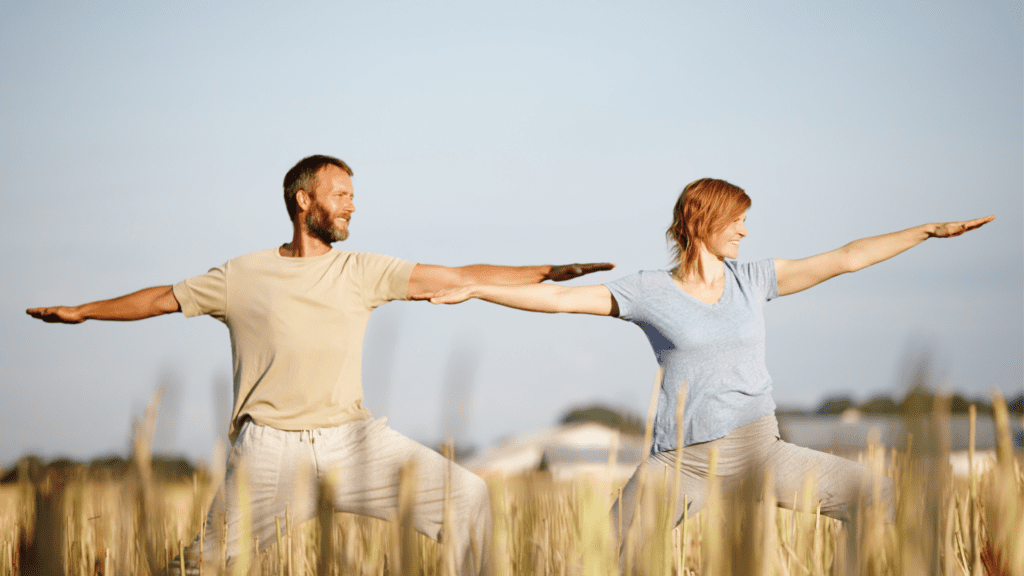 A couple practicing yoga and finding balance in their lives