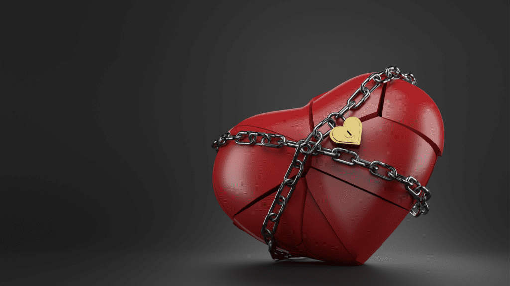 Heart wrapped in chains with a lock, illustrating emotional barriers.

 
