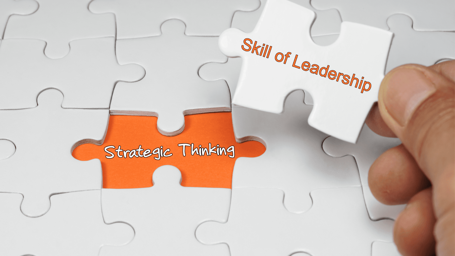 Puzzle pieces representing the connection between strategic thinking and leadership skills.