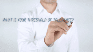 Neuroscience Updates 2 A man writing 'What is your threshold of tolerance?' to introduce the concept of emotional regulation in neuroscience.