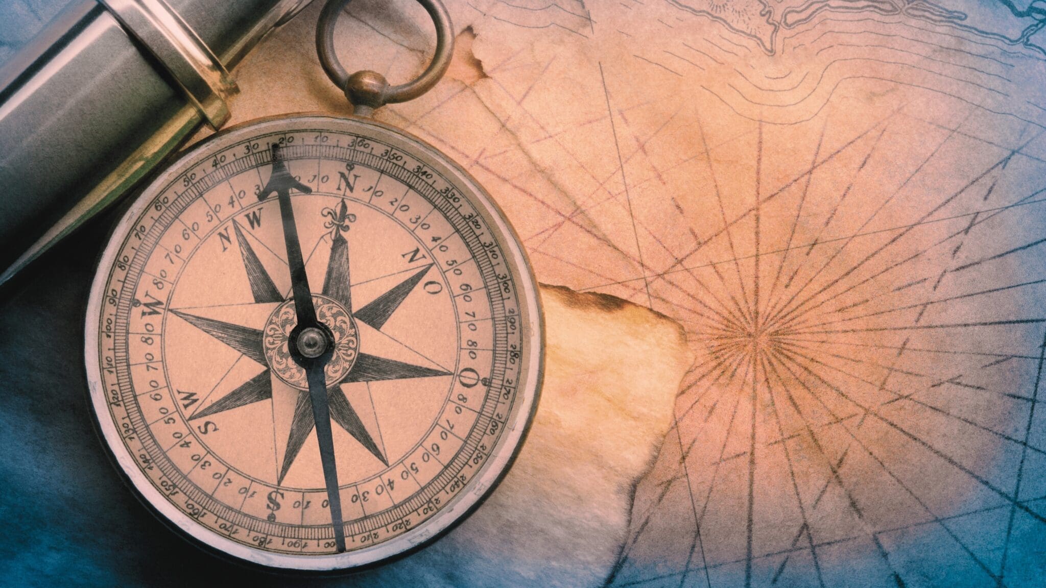 Antique compass and navigational chart symbolizing personal transformation, clarity, and direction in neuroscience-based coaching at MindLAB Neuroscience
