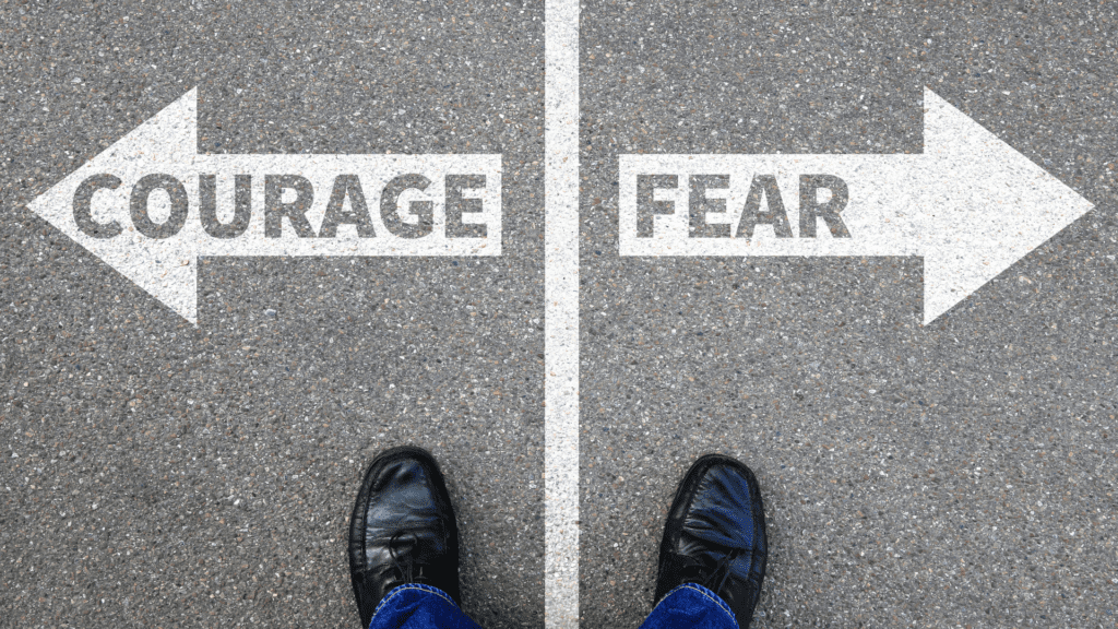 Crossroads showing opposing directions for courage and fear choices
