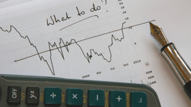 A handwritten financial chart with the phrase 'What to do?' symbolizing financial decision-making challenges.