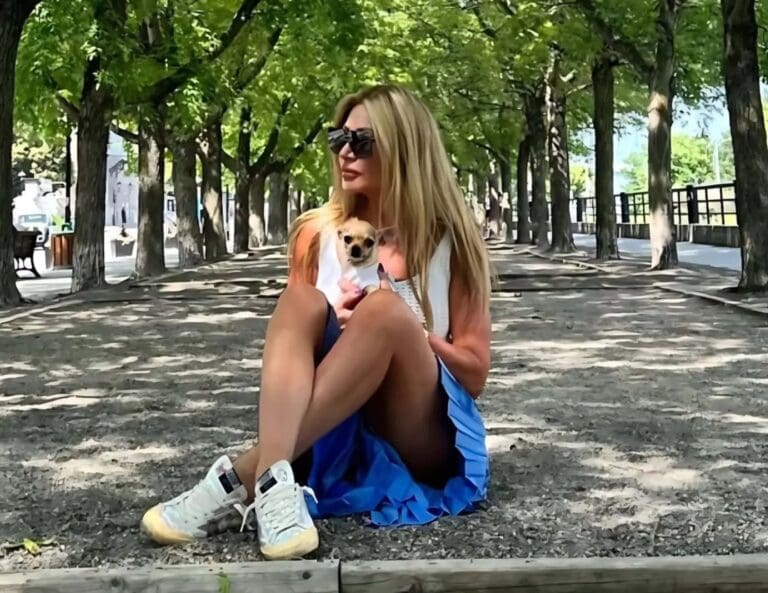 About Me – Dr. Sydney Ceruto sitting outdoors in a shaded park, reflecting her neuroscience-based coaching philosophy and authentic lifestyle at MindLAB Neuroscience