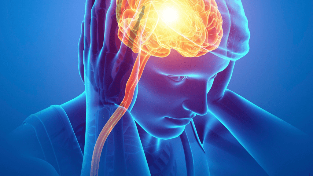 Illustration of a person holding their head with highlighted brain activity, showing areas associated with psychological pain.


