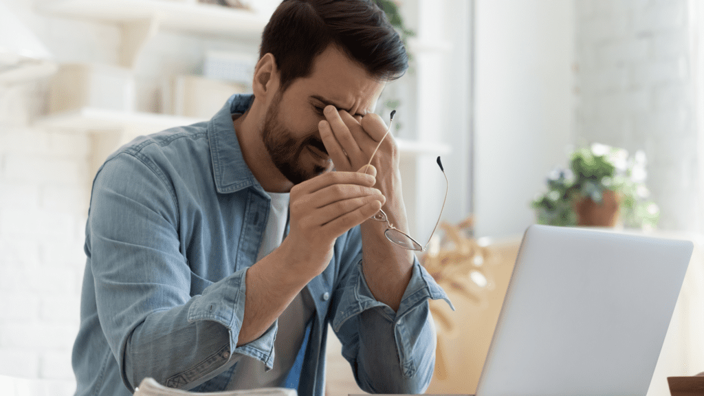 man experiencing digital workplace burnout and mental exhaustion
