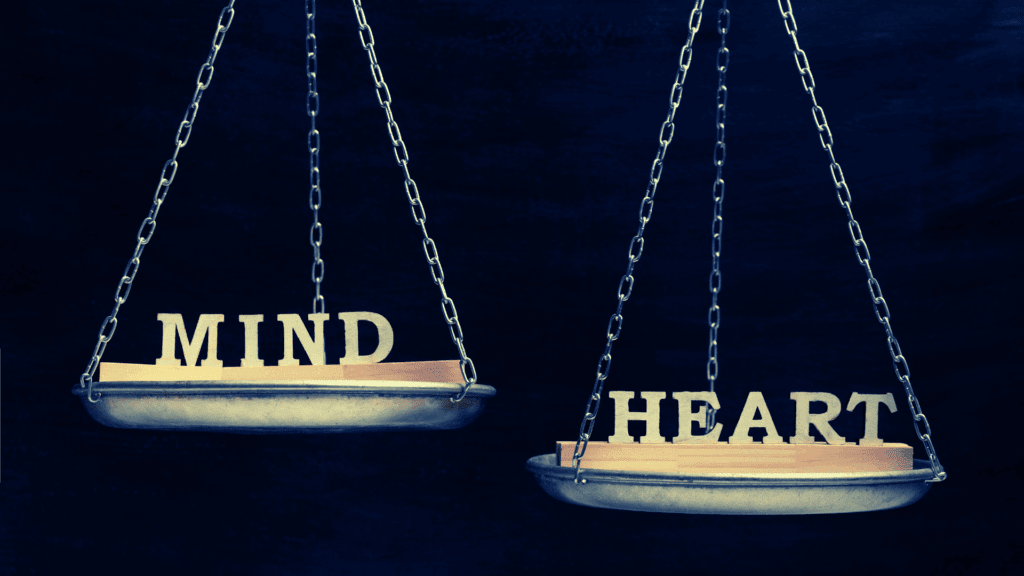 Mental Health in Modern Dating: Unraveling Emotional Complexities 9 A scale balancing the words "Mind" and "Heart," representing the intersection of emotions and logic in relationships.