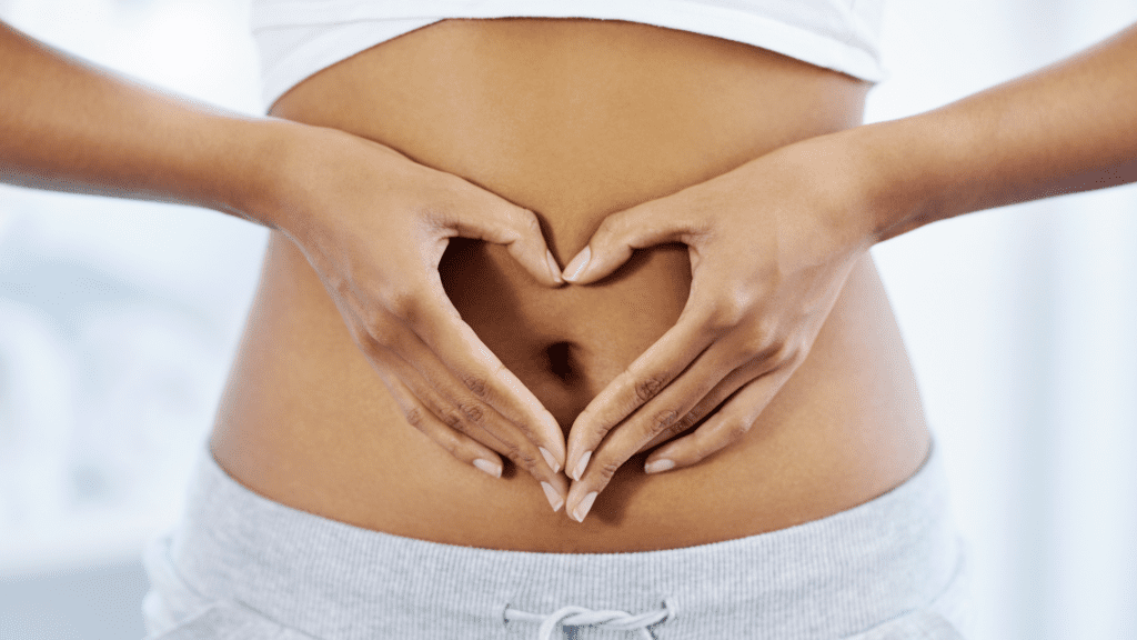 The Extraordinary Mind-Body Connection: Master Your Health Through Neuroscience 3 Hands forming heart shape on bare abdomen illustrating mind-gut connection.