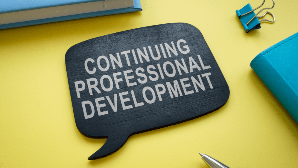 A black speech bubble sign displaying "Continuing Professional Development" on a yellow background, symbolizing career growth and lifelong learning.


