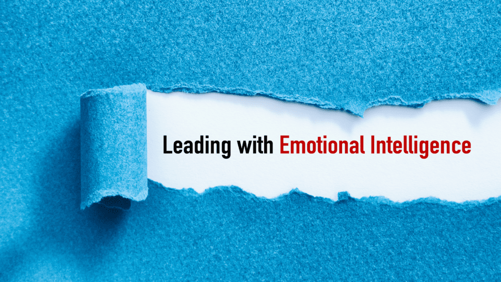 A torn blue paper revealing the phrase "Leading with Emotional Intelligence" in bold letters, emphasizing the importance of EQ in leadership.

