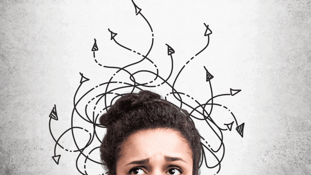 The Counterintuitiveness of the Brain: Why Your Mind Fights Change (And How to Win) 8 Confused woman looking up at tangled arrows representing the counterintuitiveness of the brain and chaotic thought patterns.