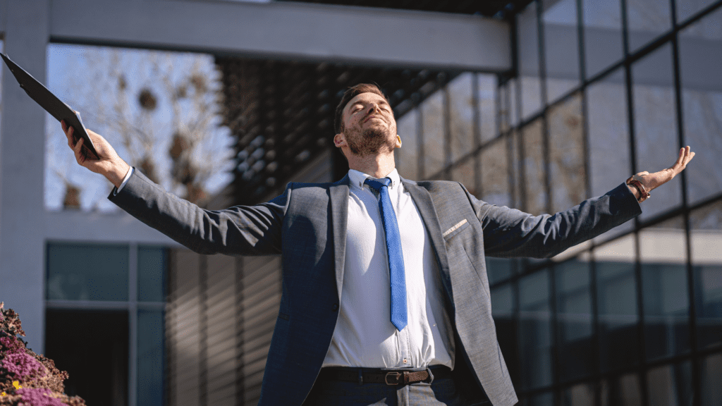 A professional celebrating success and empowerment after overcoming feelings of being underappreciated at work.