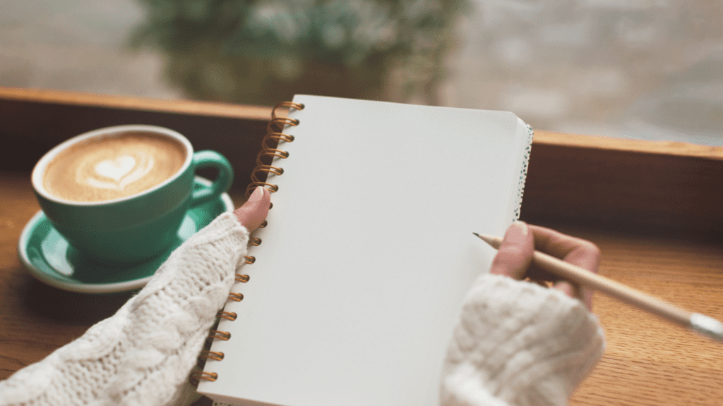 The Neuroscience of Feeling Underappreciated at Work: Why It Happens and How to Overcome It 3 A person journaling to practice self-recognition and combat feelings of being underappreciated at work.