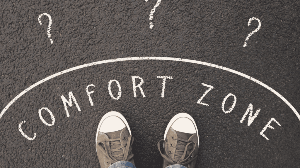 Standing at the edge of a comfort zone with question marks, symbolizing the neuroscience of insecurity





