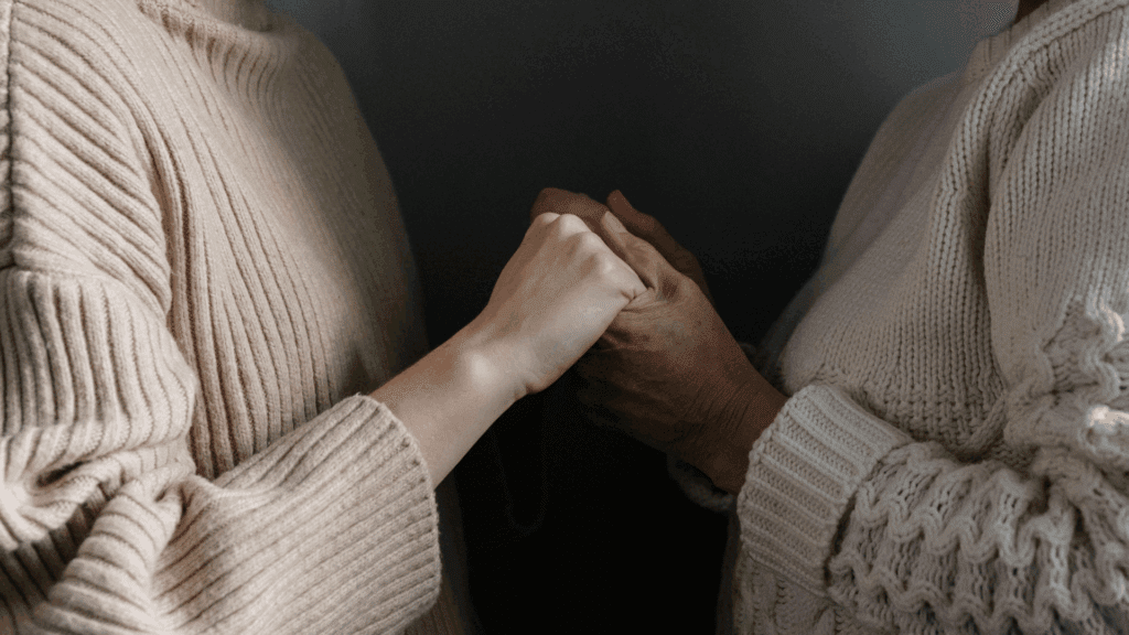 The Neuroscience of Reassurance-Seeking: Why We Can’t Stop Asking “Are You Sure?” 4 Two people holding hands for emotional support during reassurance-seeking