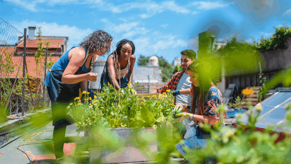 Group of people gardening together outdoors, demonstrating digital detox through real-world connection and nature.






