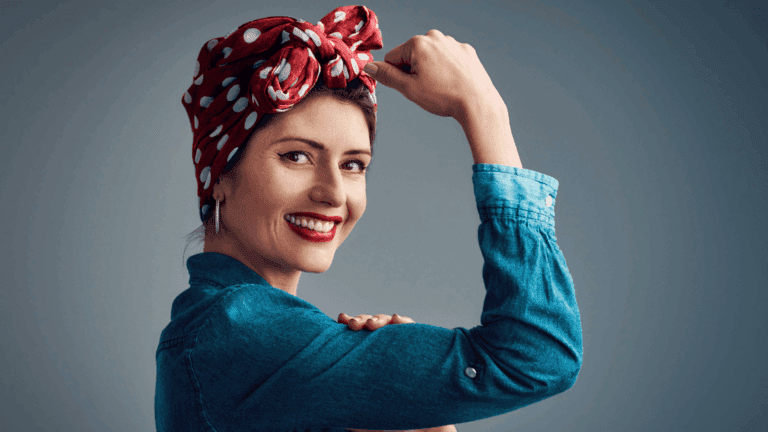 On the Blog 4 A person in a denim shirt flexing their arm, symbolizing hyper independence and inner strength.