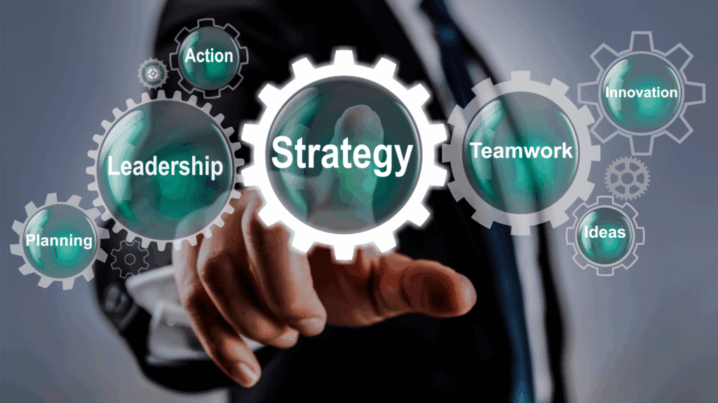 A business professional pointing at gears labeled leadership, strategy, and teamwork, representing hyper independence in the workplace. A professional interacts with virtual gears, showing how hyper independence influences leadership, strategy, and collaboration at work.