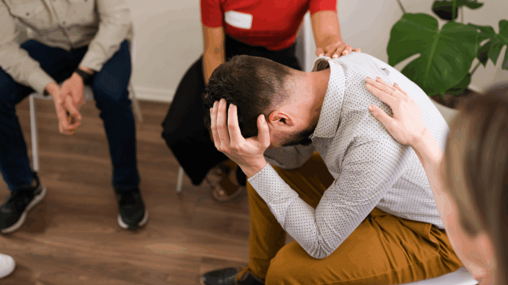 Diverse group in a support setting discussing the neuroscience of sex addiction
