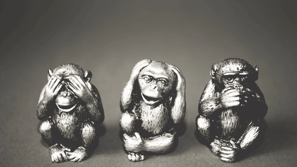 Three wise monkeys figurines illustrate the neuroscience of taking the high road by embodying the principles of mindful restraint.