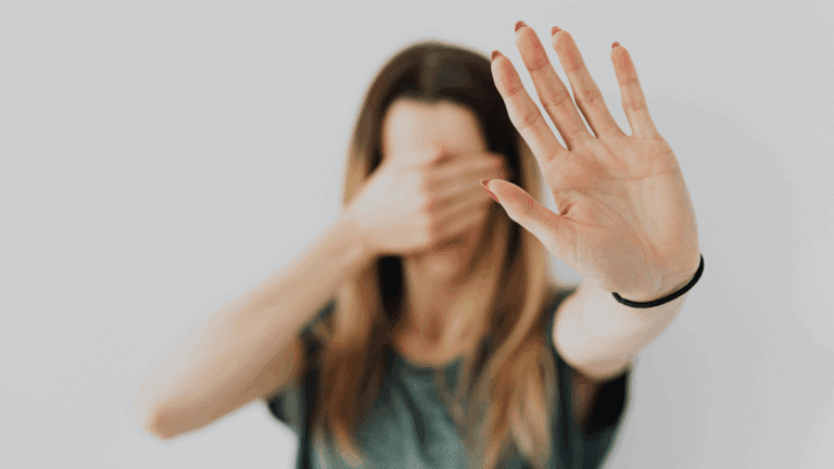 On the Blog 5 Person holding up a hand in a stop gesture, reflecting resistance to change and readiness for change.