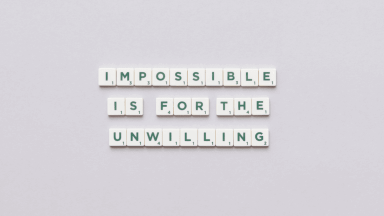 On the Blog 8 Scrabble tiles spelling “Impossible is for the unwilling” representing mindset mastery